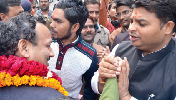 SP’s Anurag Bhaduria, who is contesting on a Congress ticket from Lucknow east, with SP minister Abhishek Mishra, who is contesting from Lucknow north.