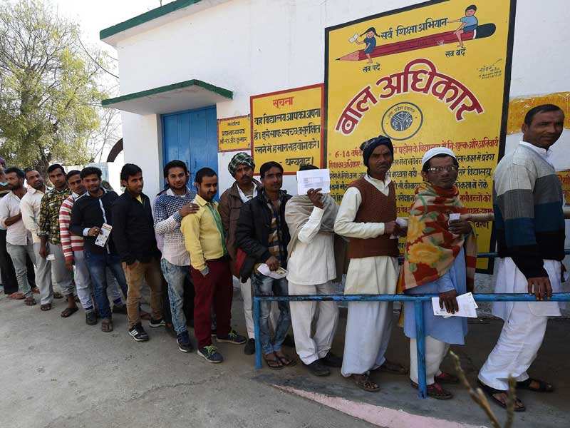 People queued to cast their votes in Muzaffarnagar, Uttar Pradesh, on February 11. (AFP photo)