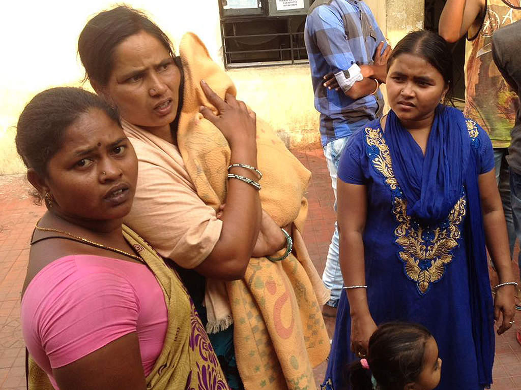 Bereaved family members of scavengers from Andhra Pradesh who died inside a manhole on Monday night.