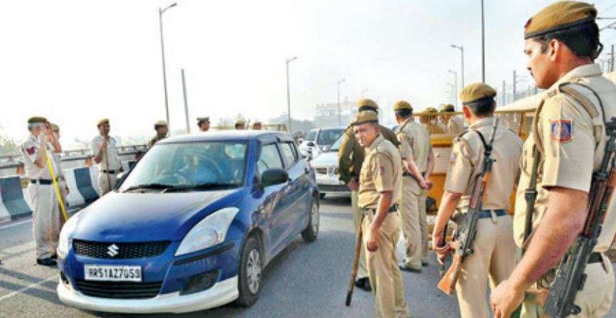 Police check vehicles entering Delhi through Haryana, on Monday