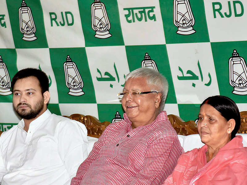RJD Chief Lalu Prasad Yadav with wife Rabri Devi and Bihar Deputy Chief Minister Tejaswi Yadav. ( Photo: PTI).
