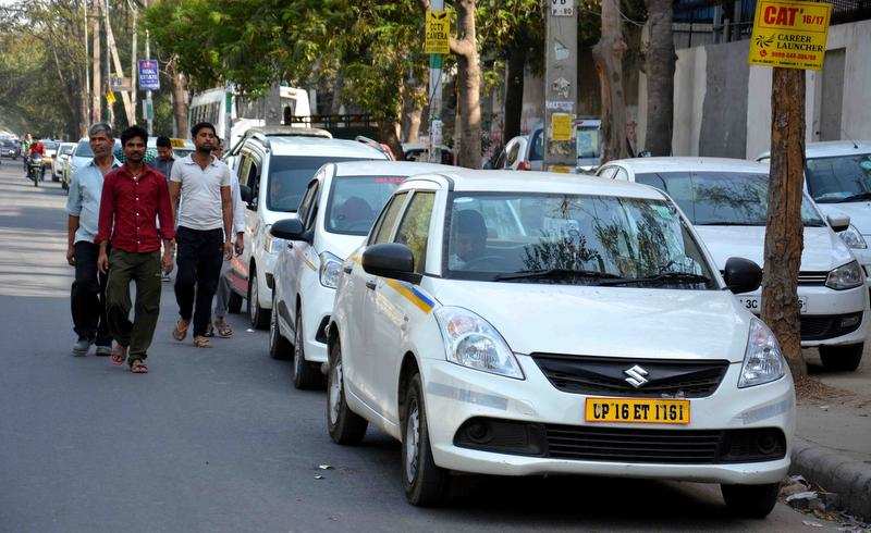Cabs, parked on Shankar Road, further escalate the traffic problem.