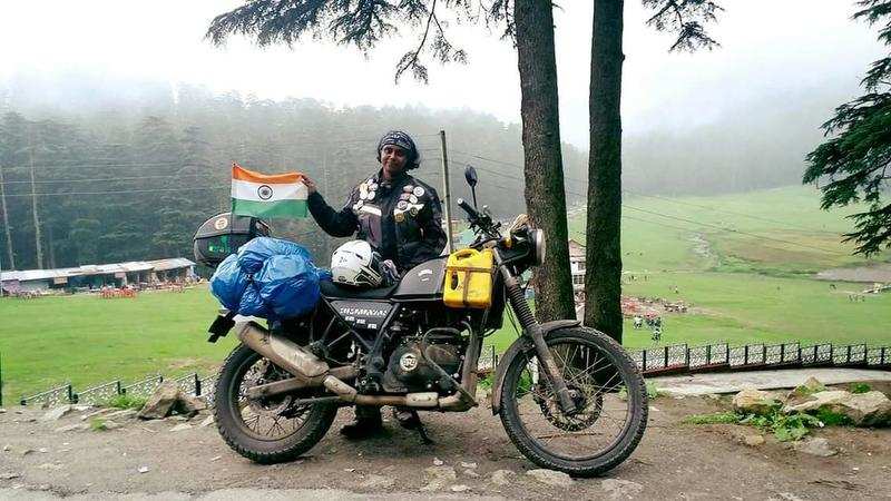 Shyni with her favourite motorcycle at Khajjiar in Himachal Pradesh