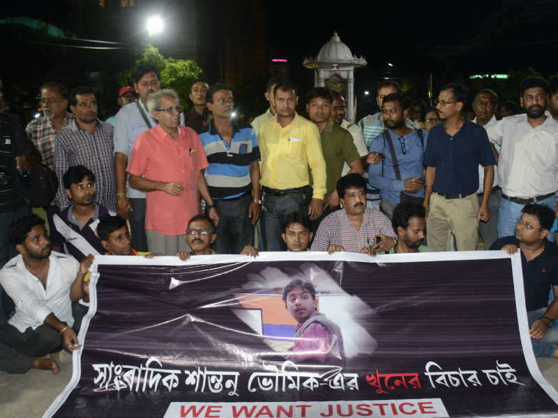 Indian journalists at a road blockade set up over the killing of journalist Shantanu Bhowmick in Agartala. (AFP photo)