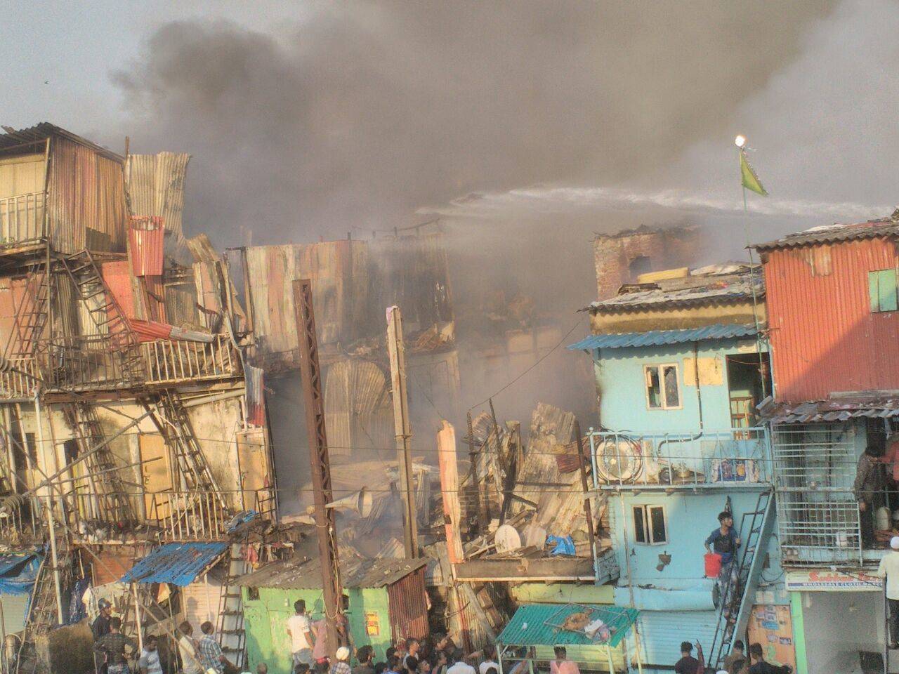 The fire engulfed around 300 hutments and left three firemen injured.