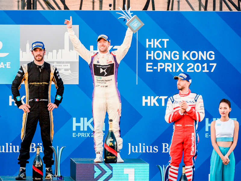 Sam Bird (C) celebrates on the podium as second-placed Jean-Eric Vergne (left) and third-placed Nick Heidfeld look on. (AFP Photo)