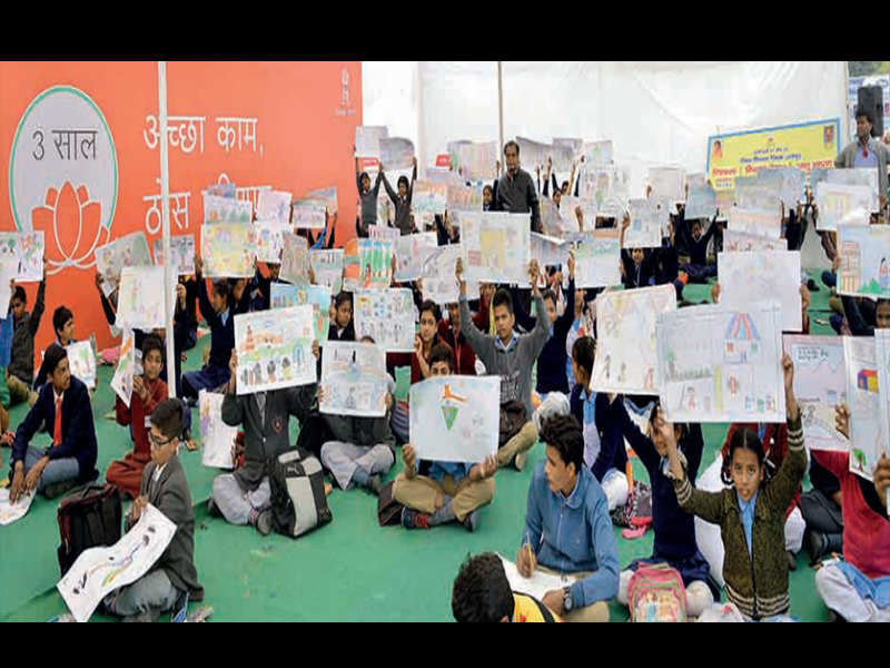 File pic of school kids taking part in a painting competition organised by the government at Ramlila Maidan