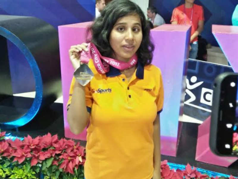 Kanchanmala Pande flashes her gold medal after winning the 200m medley at the World Para Swimming Championship. (TOI Photo)