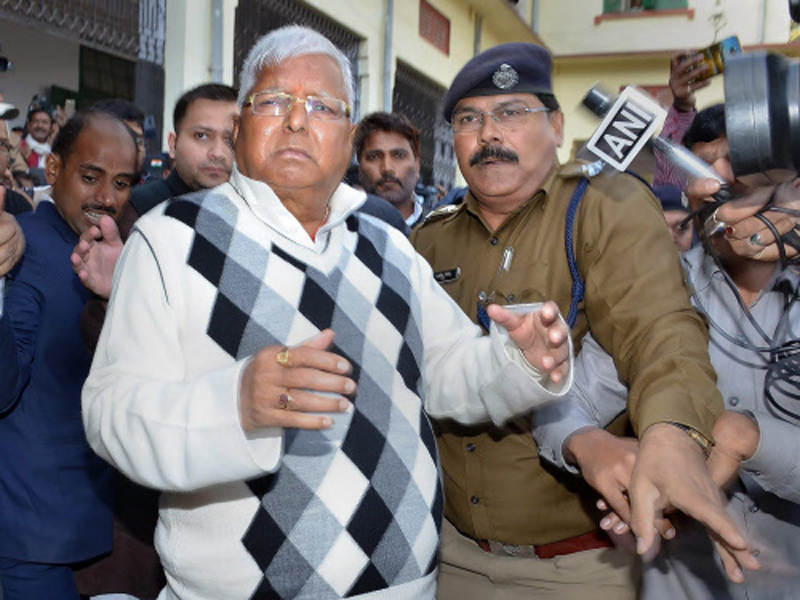 Lalu Prasad Yadav escorted by police officials after being convicted by the special CBI court in fodder scam case, in Ranchi. (PTI Photo)