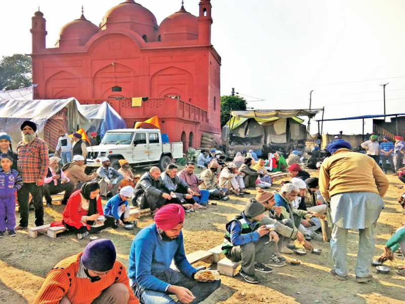 Langar being served to devotees on the premises of Lal Masjid in Fatehgarh Sahib during Shaheedi Jor Mela on Monday.