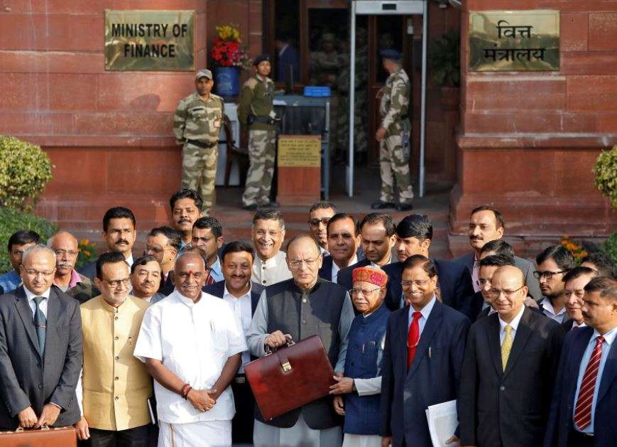 Finance Minister Jaitley holds his briefcase as he leaves his office to present the Budget in the Parliament in New Delhi. (Reuters photo)