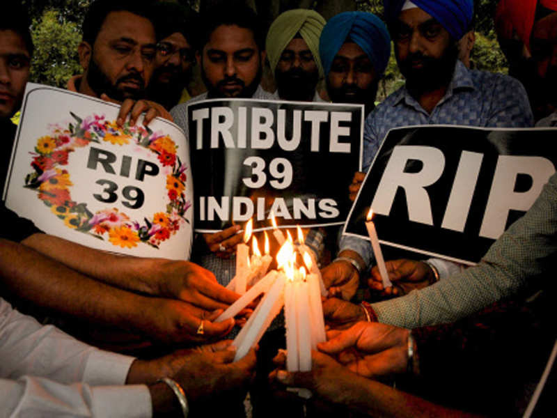 Members of National Human Rights and Crime Control Organisation light candles to pay tribute to the 39 Indian workers, who were killed in Iraq, in Amritsar on Tuesday. (PTI photo) 