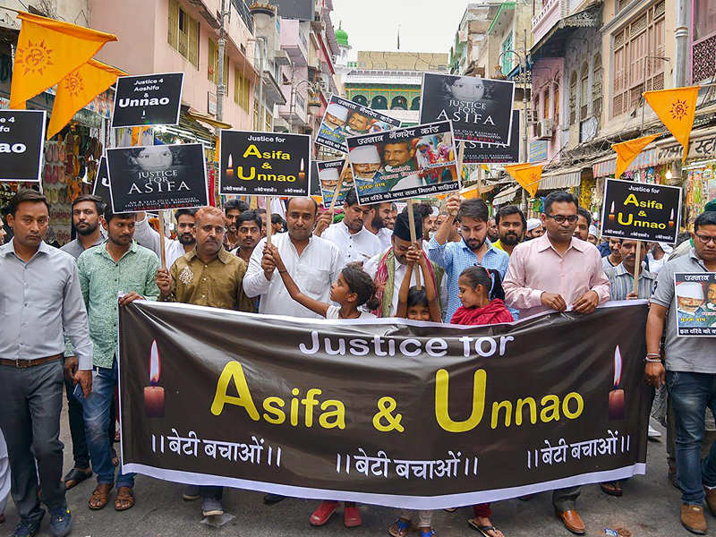 People hold a protest rally over Central Government's alleged inaction in Kathua and Unnao rape incidents, in Ajmer