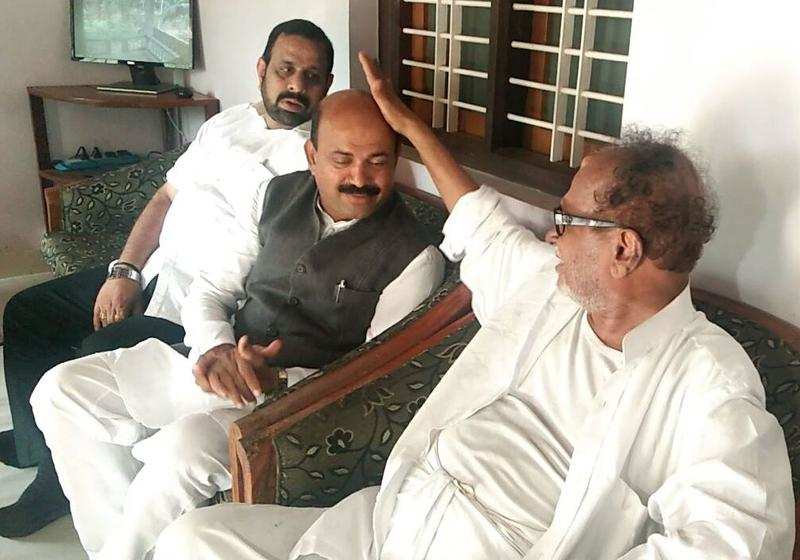Seeking blessings:  B A Mohiuddin Bava, Congress candidate from Mangaluru City North constituency seeking blessings of veteran Congress leader B Janardhana Poojary at his residence in Bantwal on Friday