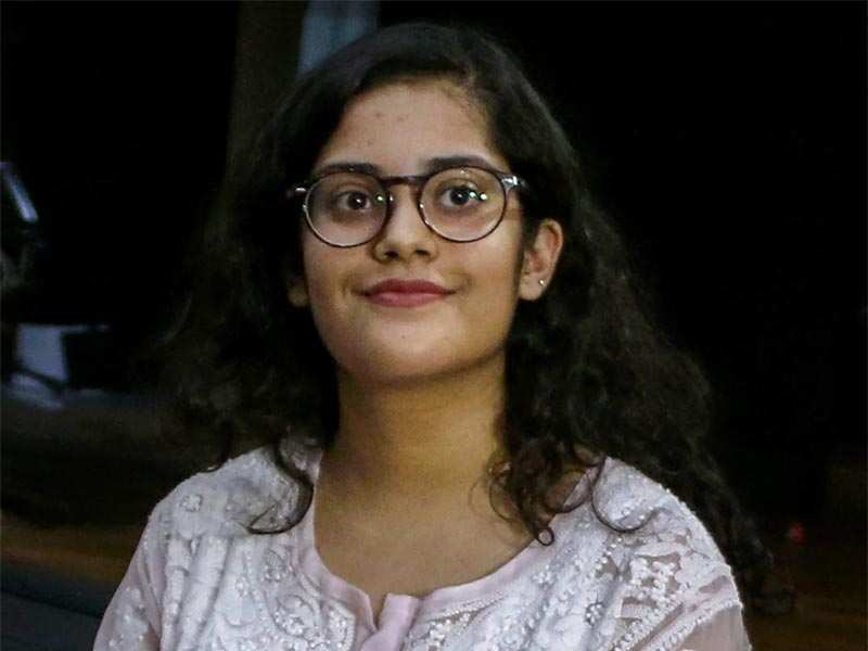 Meghna Srivastava, who secured the first position in CBSE's 12th class exams, in Noida on Saturday. (PTI Photo)