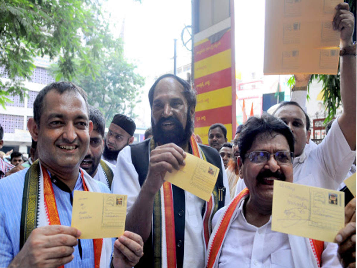 Congress leaders show postcards addressed to CM KCR asking him to implement 12% quota for Muslims, in the city on Monday