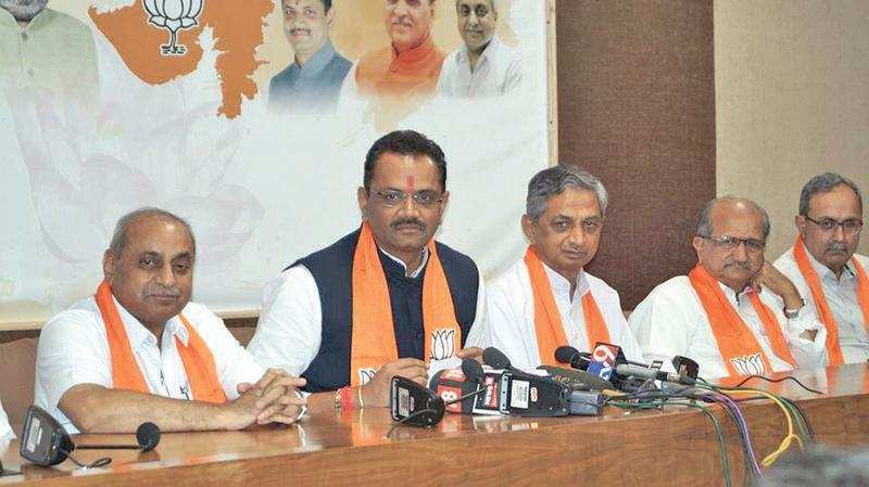 Kunwarji Bavaliya with BJP leaders during his induction into the party on Tuesday