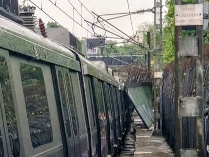 A disaster was averted and passengers of a metro train had a miraculous escape when a large portion of a metal railing fell on moving train on the Violet Line on Thursday evening due to strong winds.