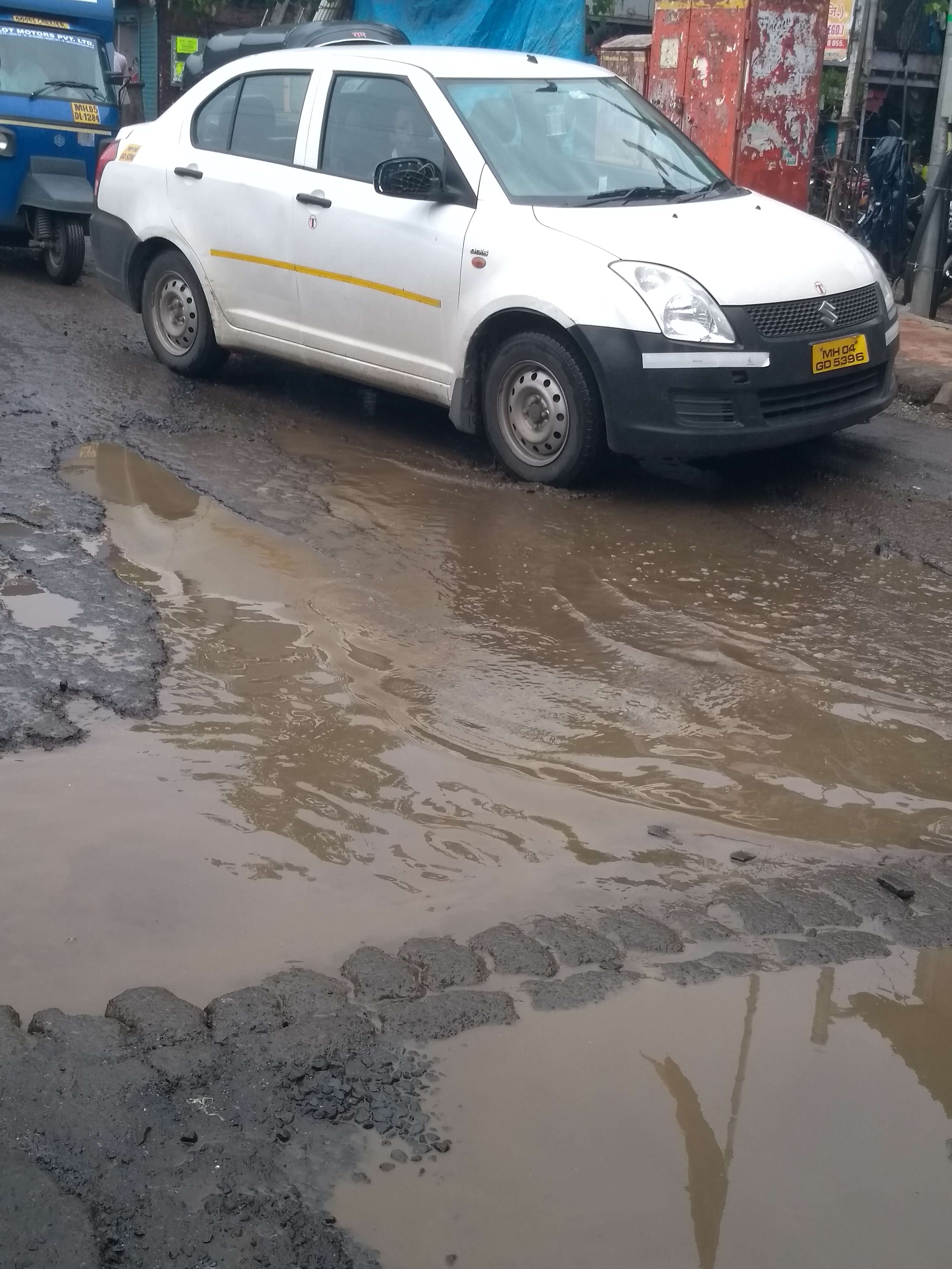 Some potholes on road or some road in potholes? - Times of India