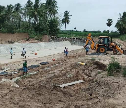 Construction of a check dam across the Lava river is going on near S R Puram mandal in Andhra Pradesh 