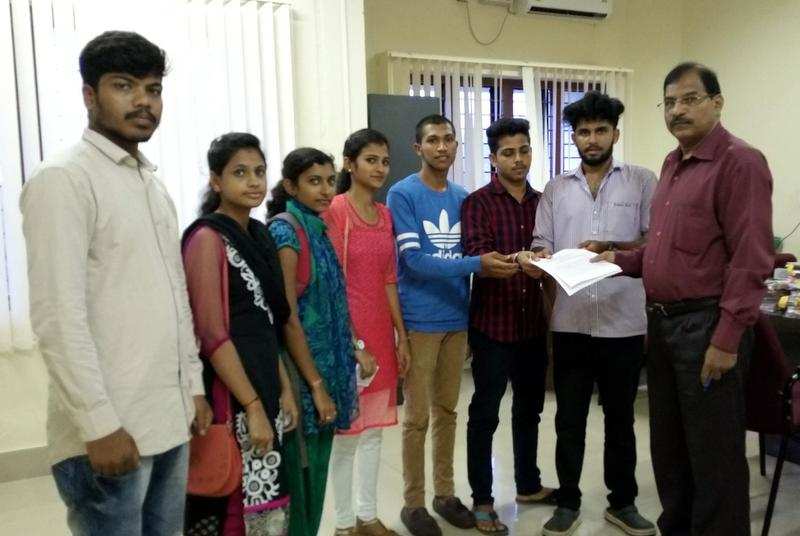 Conservative appeal:  ABVP members submitting a memorandum regarding the Kannada textbook issue to Nagappa Gowda, special officer, Mangalore University, on Thursday