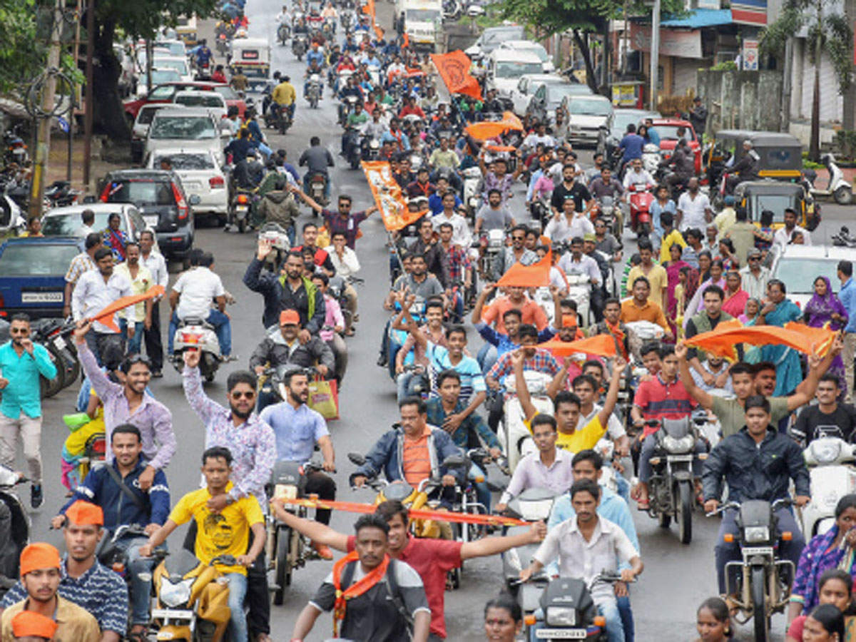Maratha community members take part in a bike protest rally against the government demanding reservation for Marathis, in Kolhapur, on Tuesday.(PTI photo)