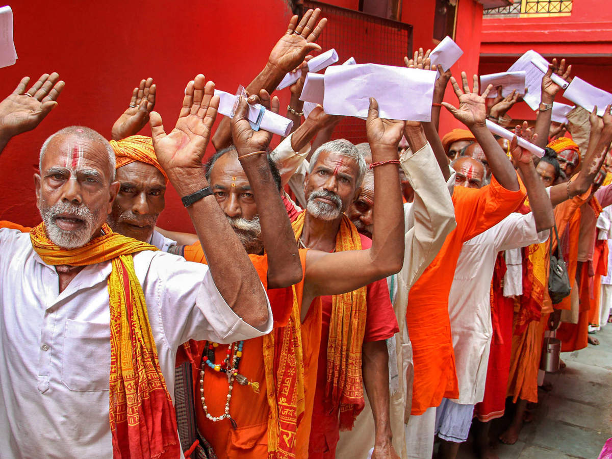Sadhus wait in queue to get themselves registered for Amarnath Yatra, at a base camp in Jammu. (PTI file photo)