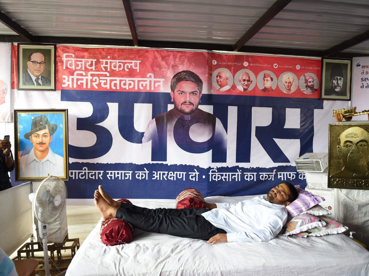 PAAS leader Hardik Patel lies down during his hunger strike. (Photo: AFP)