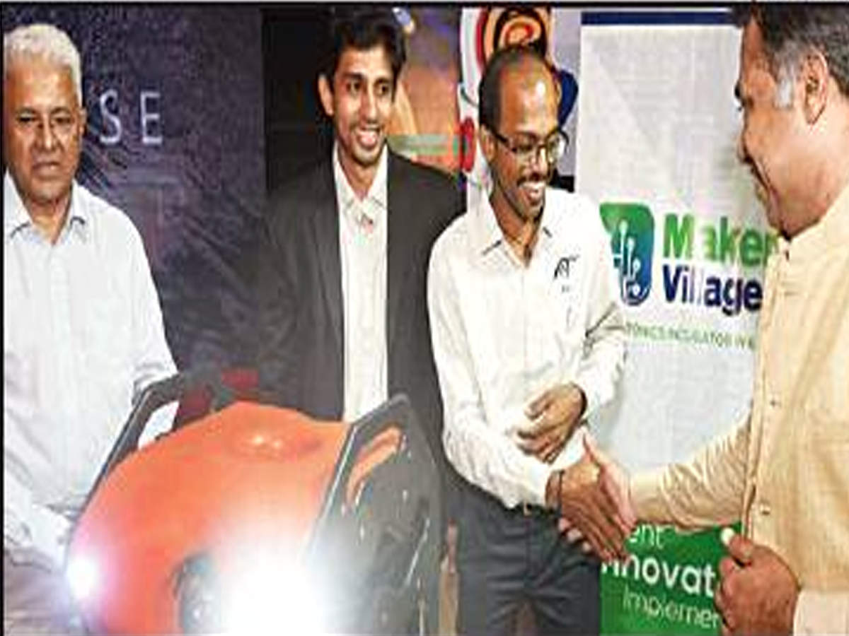 Saji Gopinath, Kerala Startup Mission CEO, greets Kannappa Palaniappan P and Johns T Mathai of EyeROV Technologies, after the launch of underwater robotic drone at Kalamassery on Friday