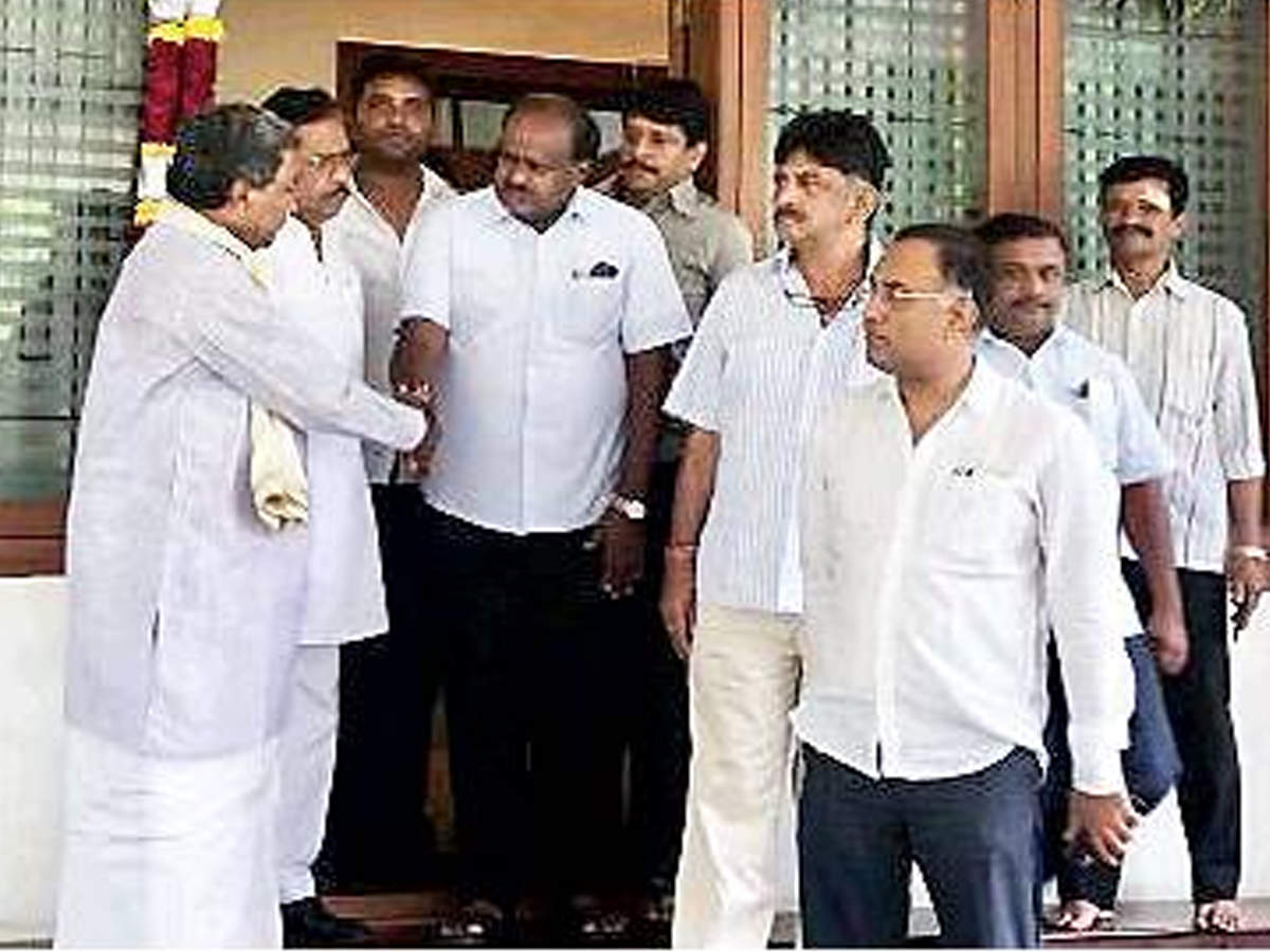 Chief minister HD Kumaraswamy and other Congress leaders at the home of former chief minister Siddaramaiah on Friday