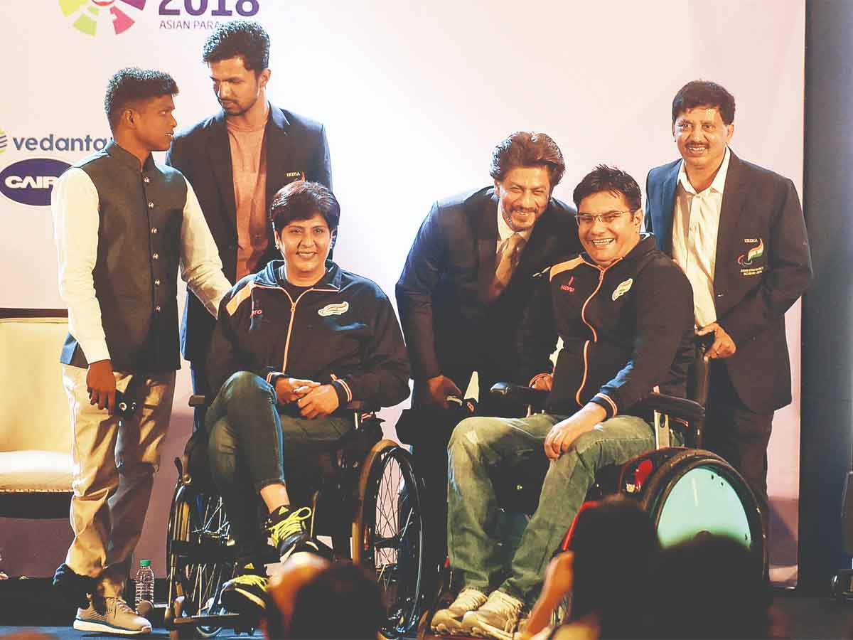 Members of the India contingent at their official send-off ceremony with Bollywood Actor Shah Rukh Khan in Delhi. (TOI Photo)