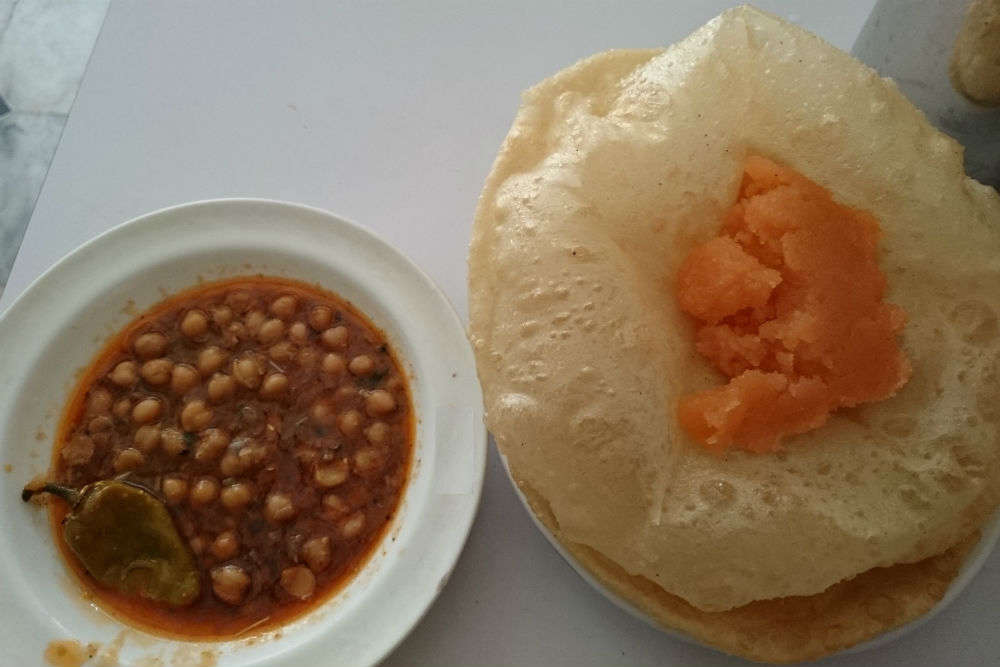 Can you cross Indian borders to eat delicious halwa, puri and chole?