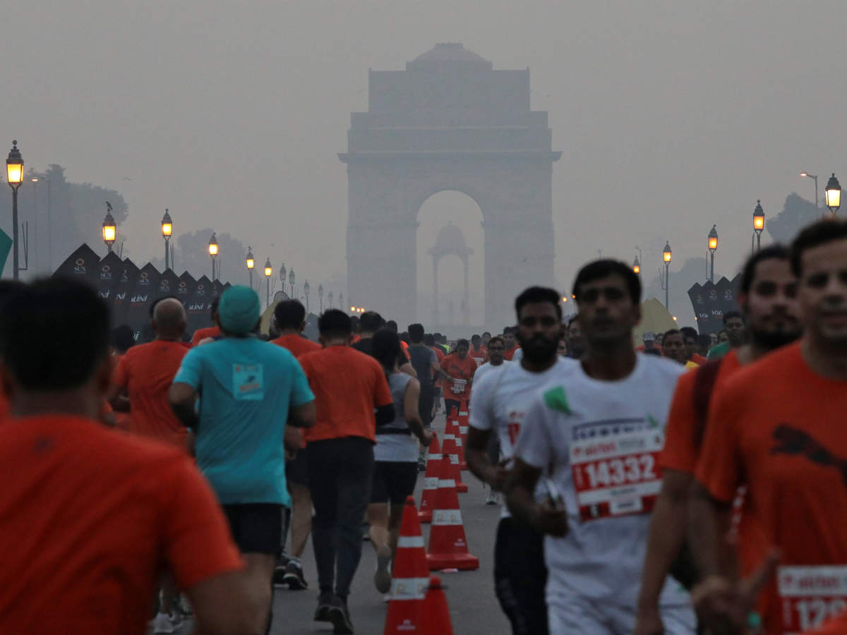 Participants run past India Gate as they take part in the Airtel Delhi Half Marathon in New Delhi.
