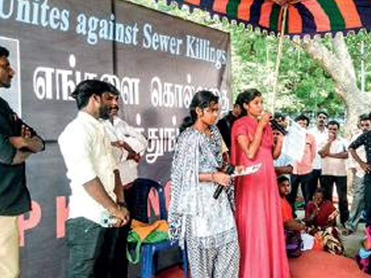 Daughters of deceased manual scavengers at 'Stop Killing Us' demonstration held at Valluvar Kottam on Wednesday