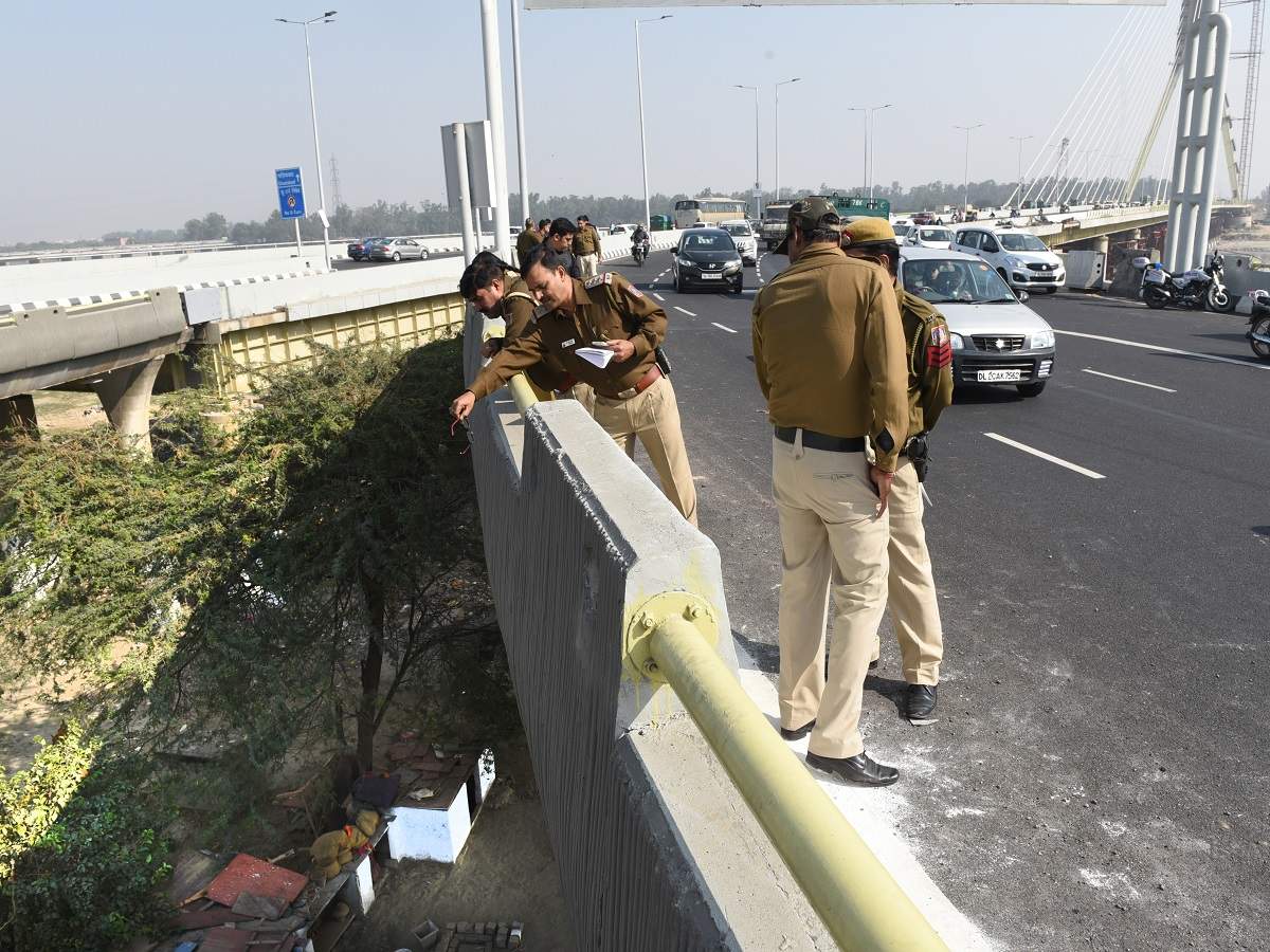 Delhi Police personnel at the accident spot on Signature Bridge where two medical students died on Friday.