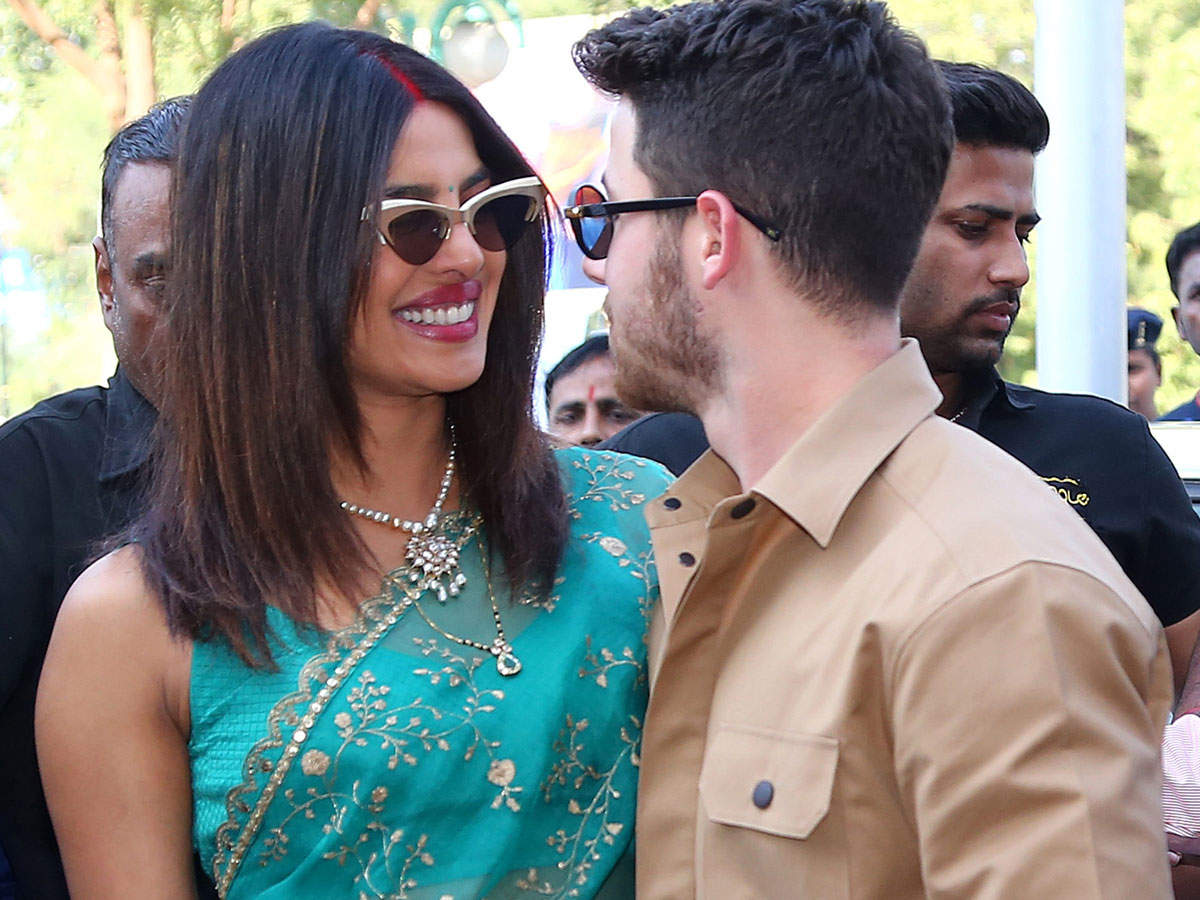 Watch: Priyanka Chopra blushes as husband Nick Jonas says 'I love you'  during their first public appearance | Hindi Movie News - Times of India