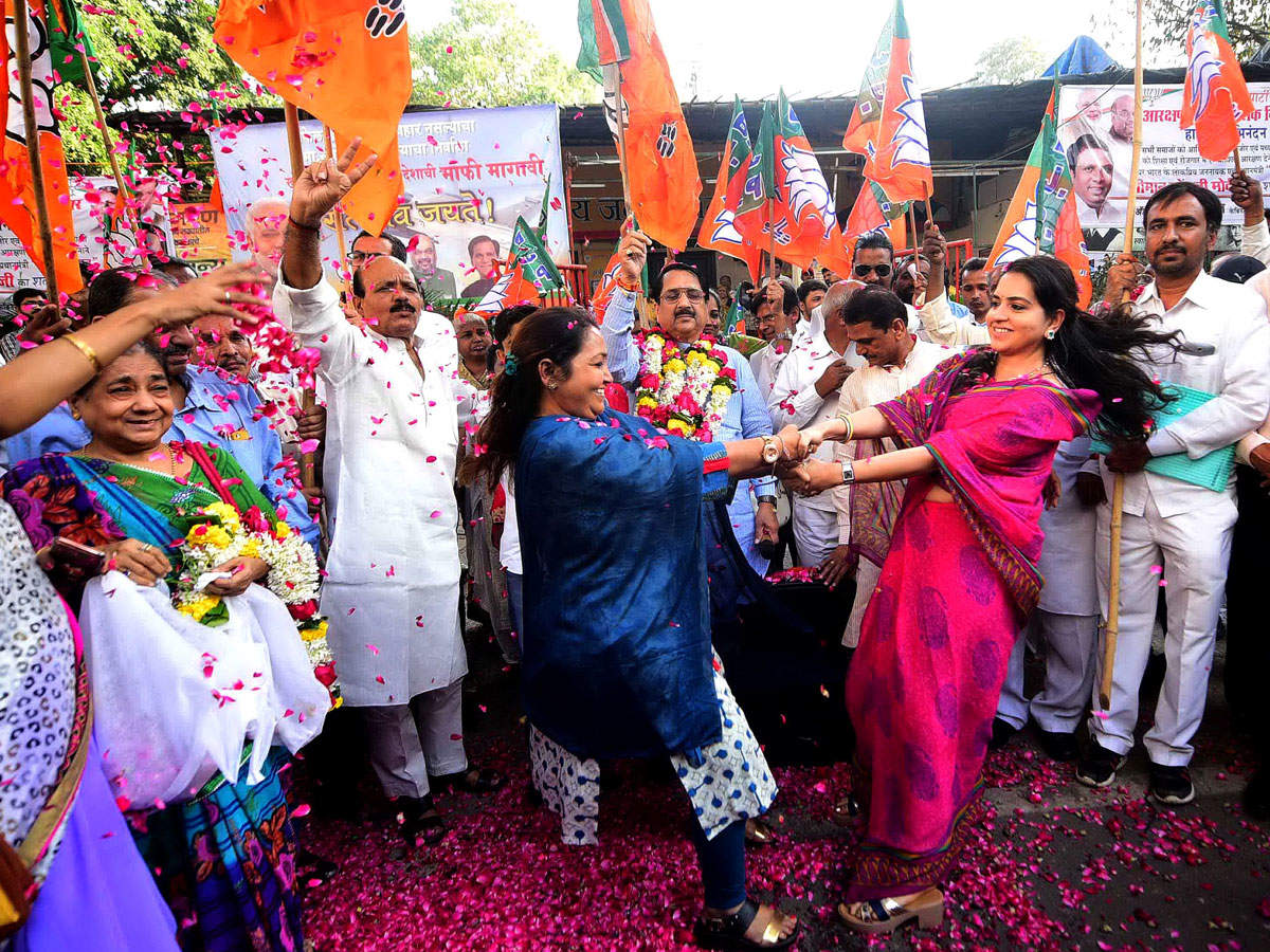 BJP workers celebrate the passage of quota bill, in Mumbai on Thursday