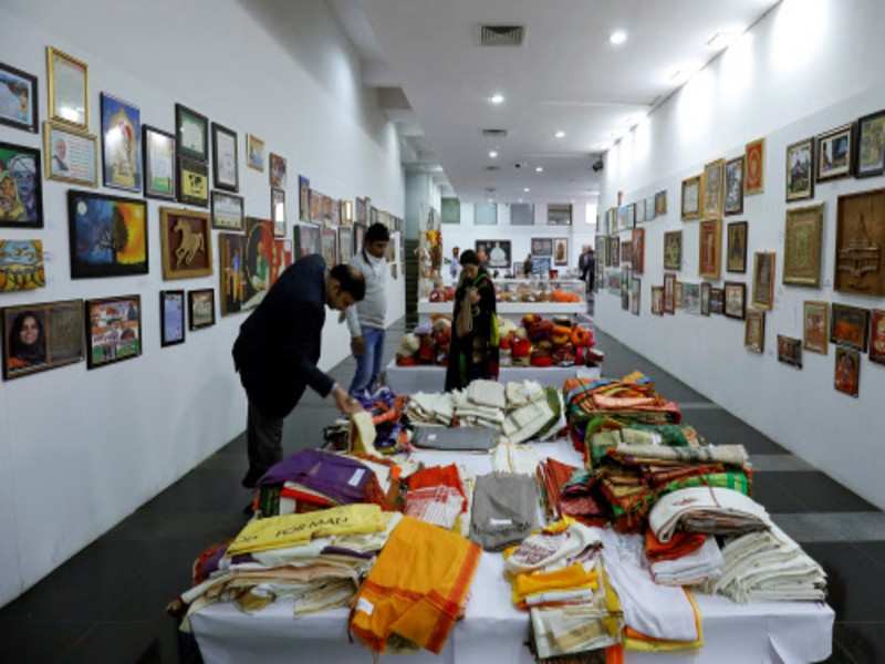 Visitors look at the gifts received by Prime Minister Narendra Modi, on display for auction at National Gallery of Modern Art in New Delhi. (PTI)