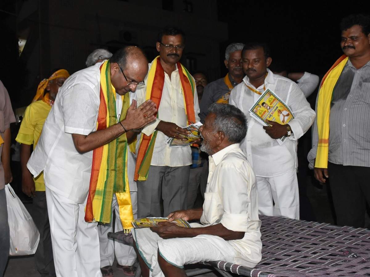 Kovelamudi Ravindra (left) interacts with a resident during his padayatra in Guntur city
