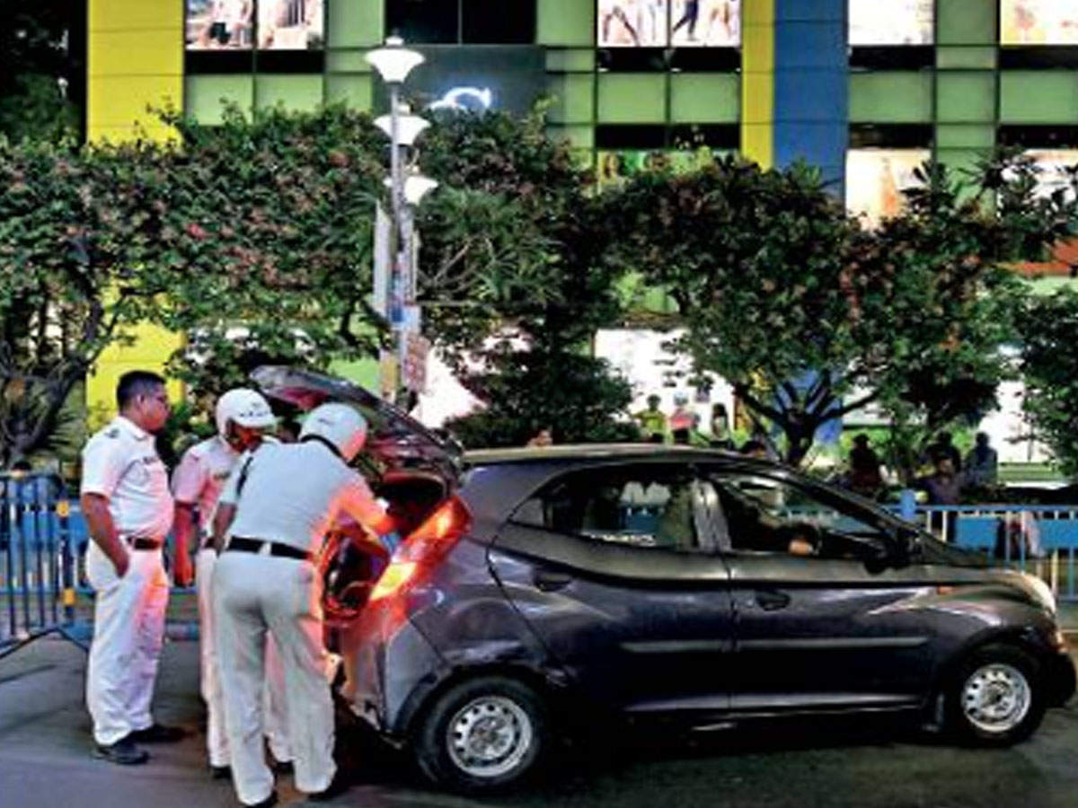 Kolkata police officers check vehicles on Elgin Road. 