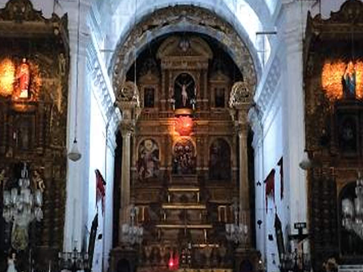 The altars of Sacred Heart of Jesus, Scared heart of Mary and the emblem of the dove on the main altar lit up by the sun’s beams