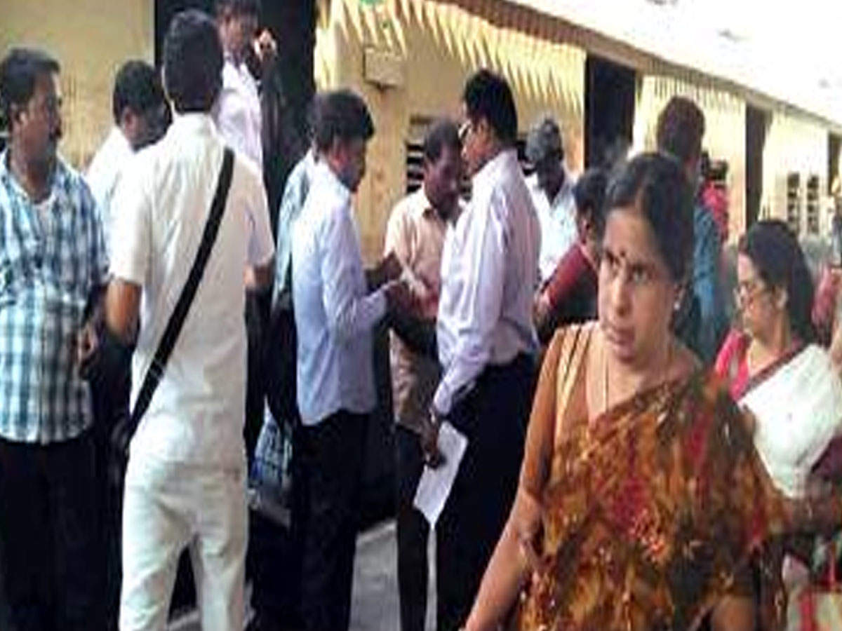 Ticket examiners check the tickets of passengers at one of the stations on Thursday.