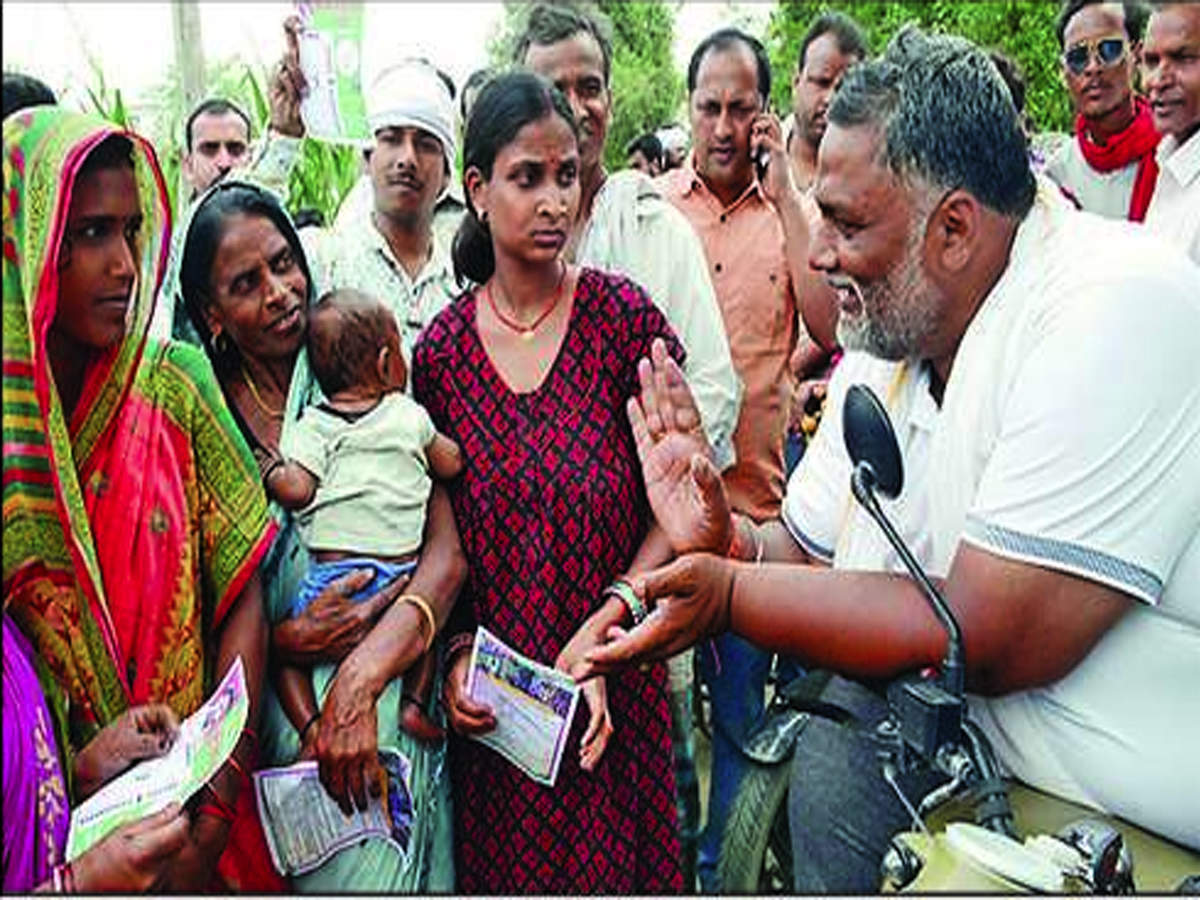 JAP-L chief Rajesh Ranjan alias Pappu Yadav interacts with people during an election campaign in Madhepura