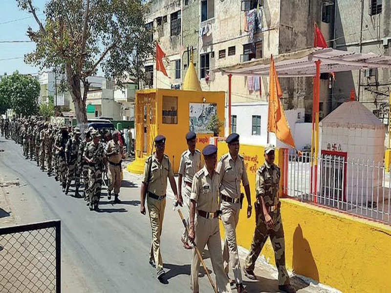 Security forces carrying out a flag march in the city