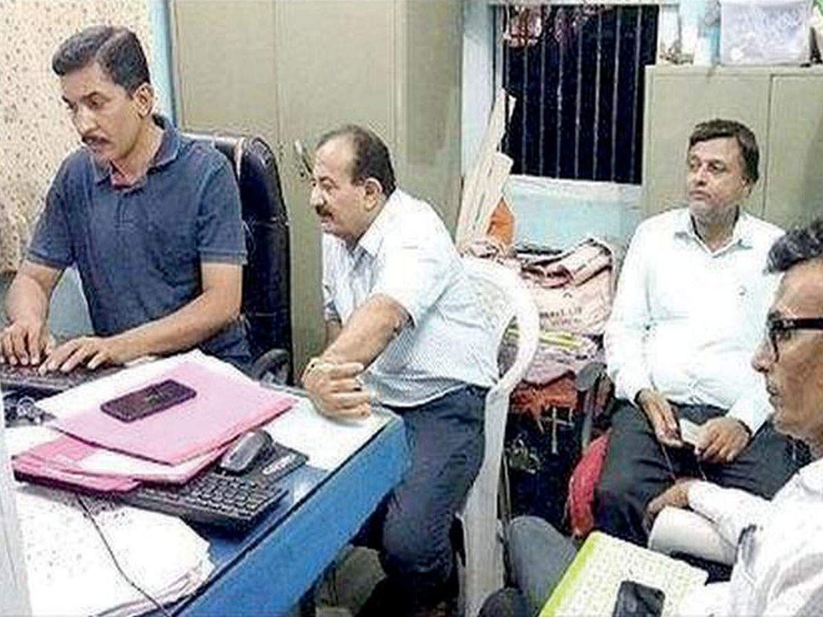Government officials lodging a complaint at Keshod police station