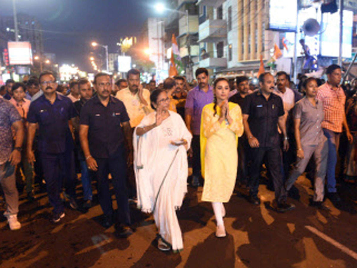 West Bengal CM Mamata Banerjee along with Jadavpur Loksabha TMC candidate Mimi Chakraborty during an election roadshow in South Kolkata.(ANI photo)