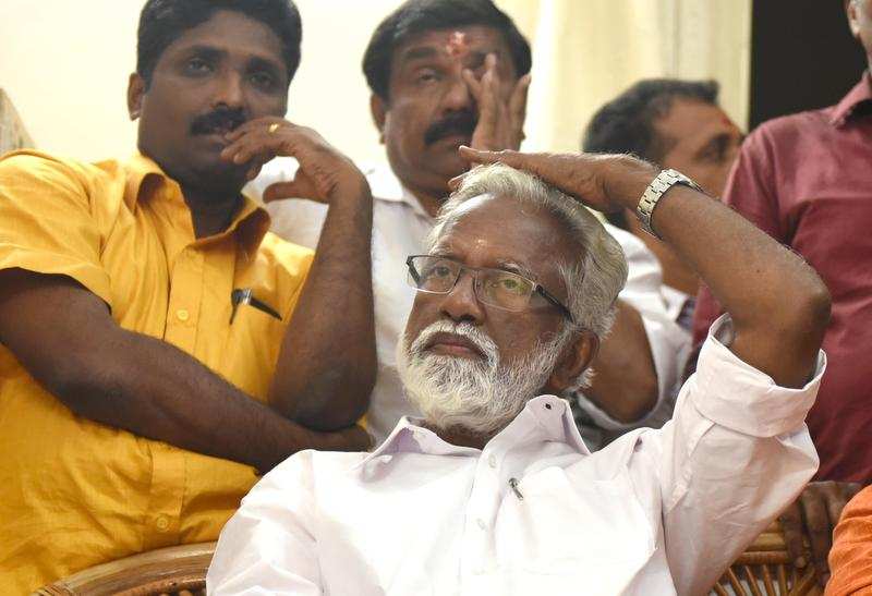 NDA candidate Kummanam Rajasekharan watches poll results on TV at the BJP office on Thursday