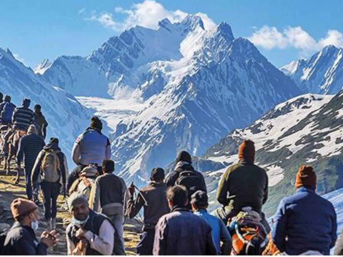 Devotees on their way to the Amarnath shrine, in Baltal, Jammu & Kashmir, on Monday