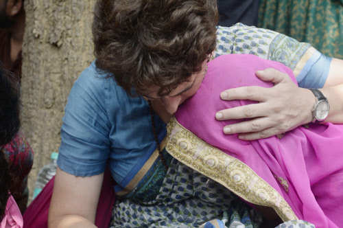 Congress General Secretary Priyanka Gandhi Vadra consoles a family member of Sonbhadra massacre victim