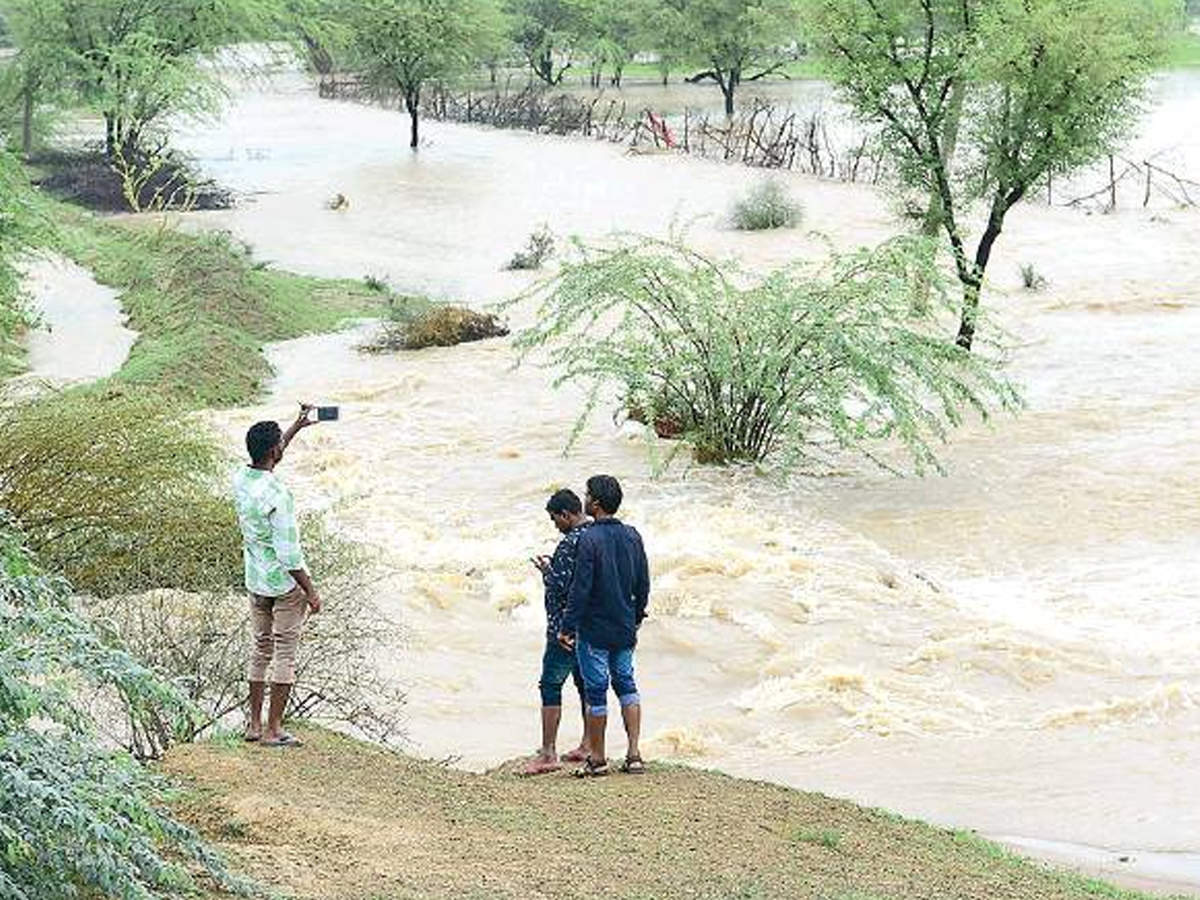 Water gushing out of the broken kuccha irrigation dam at Ravalta near Solanki-ki-dhani in Chaksu on Saturday